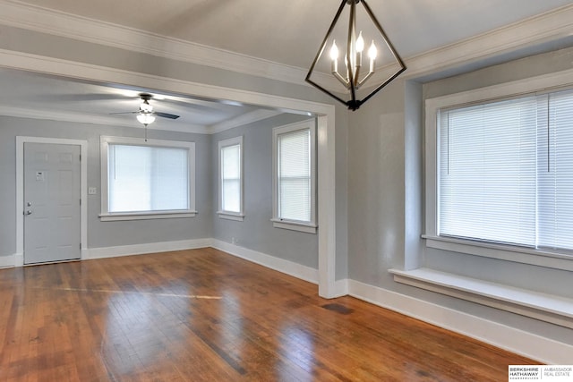 interior space with ceiling fan with notable chandelier, dark hardwood / wood-style flooring, and crown molding