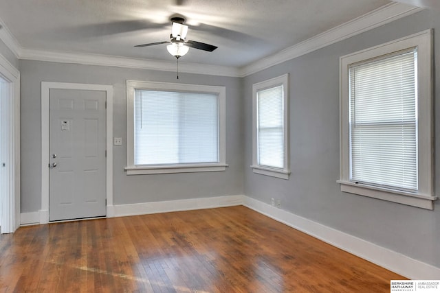 unfurnished room featuring ceiling fan, dark hardwood / wood-style flooring, ornamental molding, and a textured ceiling