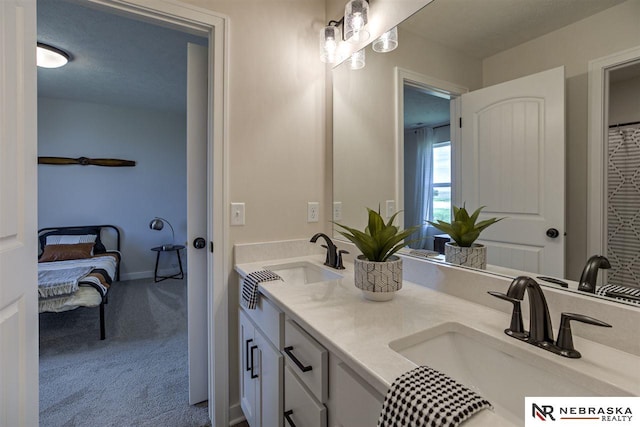 bathroom featuring a textured ceiling and vanity