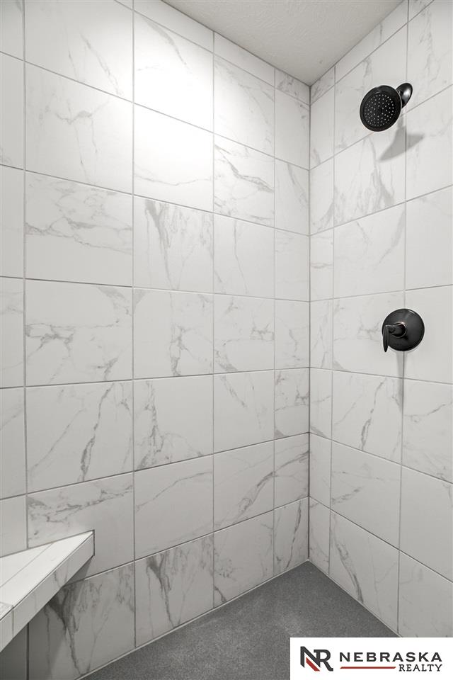 bathroom with tiled shower