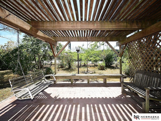 view of patio / terrace with a deck and a pergola