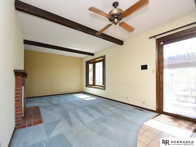 unfurnished living room with light carpet, ceiling fan, beam ceiling, and a fireplace