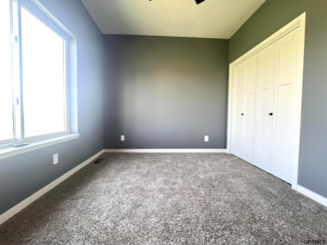 unfurnished bedroom featuring carpet flooring