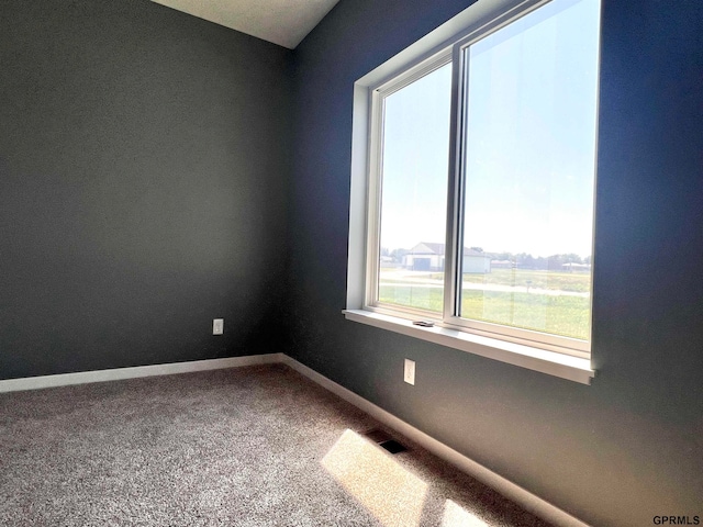 empty room featuring carpet floors