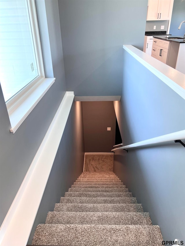 stairs featuring sink