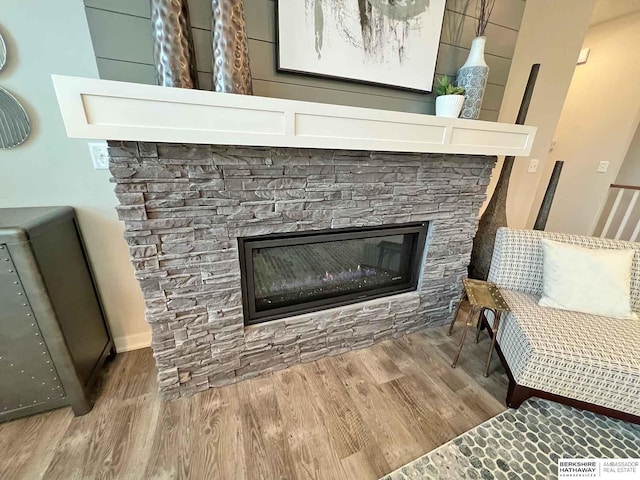 room details with a fireplace and wood-type flooring