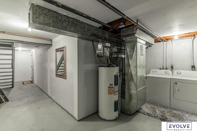 basement featuring washing machine and dryer and electric water heater