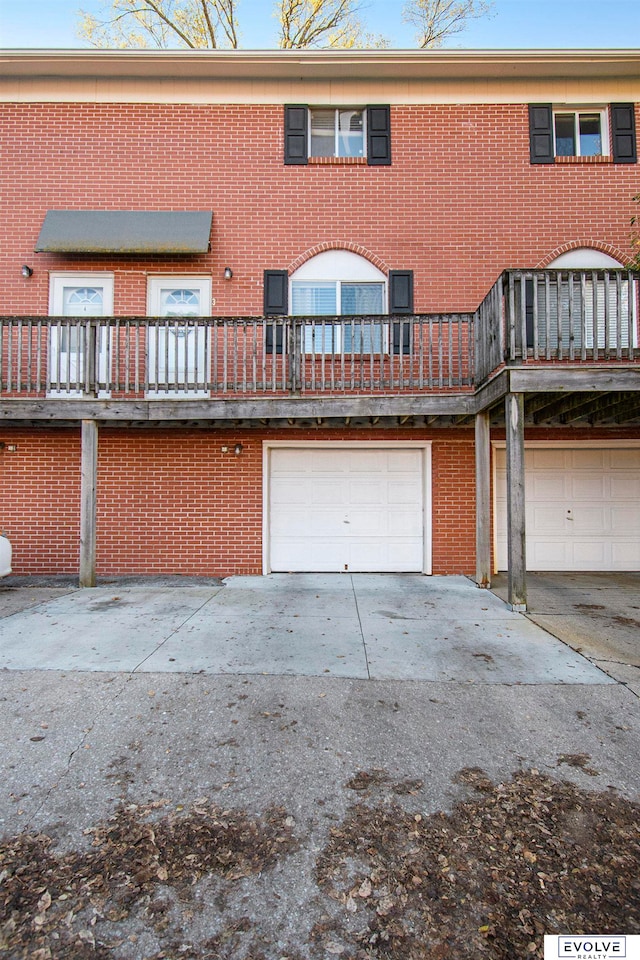 back of property with a garage