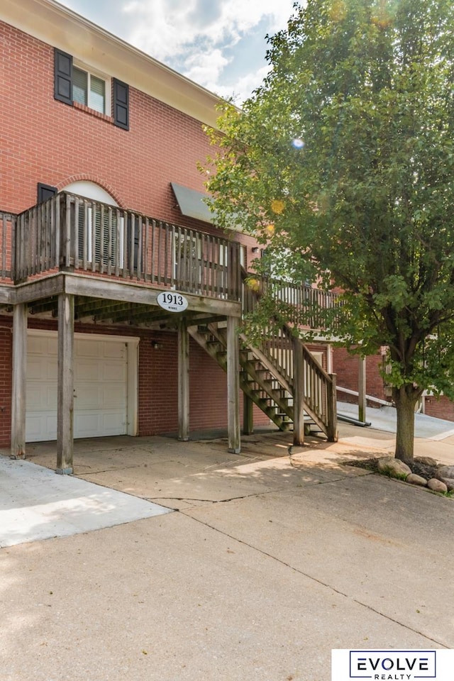 exterior space featuring a garage and a deck