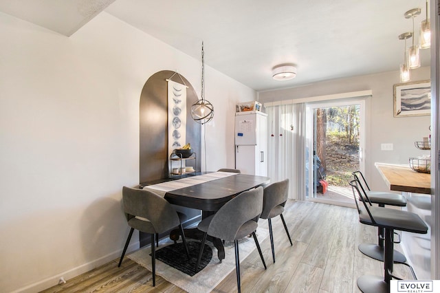 dining room featuring light hardwood / wood-style floors