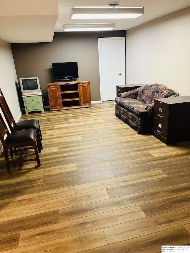 living room with light hardwood / wood-style floors