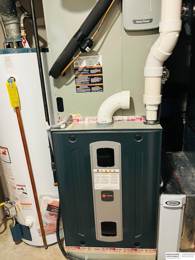 utility room with gas water heater and heating unit