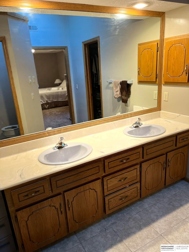 bathroom with vanity and tile patterned floors