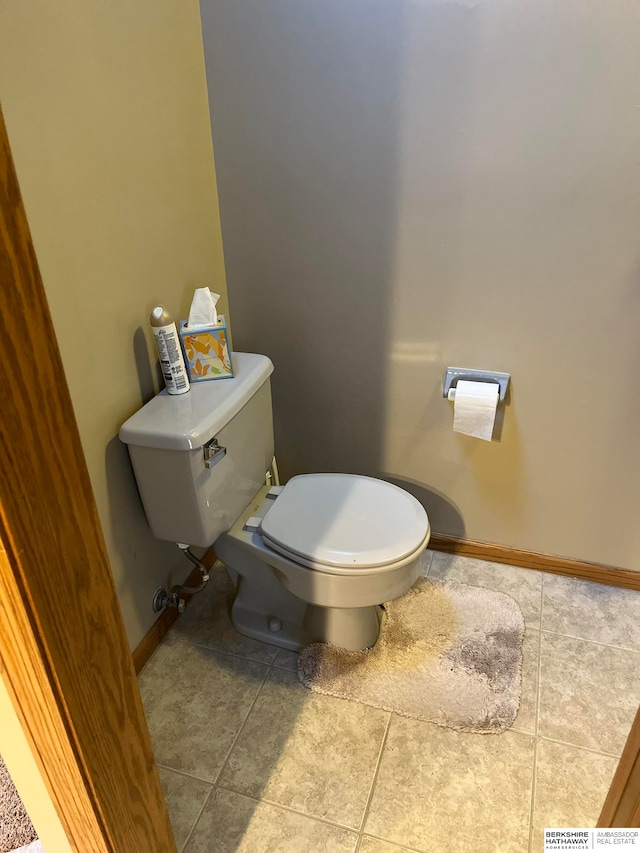 bathroom with tile patterned floors and toilet