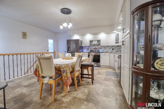 dining area featuring an inviting chandelier