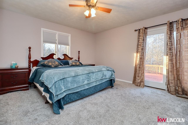 bedroom with carpet flooring, access to exterior, ceiling fan, and multiple windows