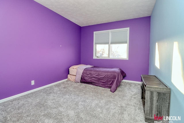 unfurnished bedroom featuring carpet and a textured ceiling