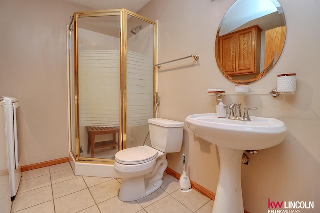 bathroom with tile patterned floors, walk in shower, and toilet