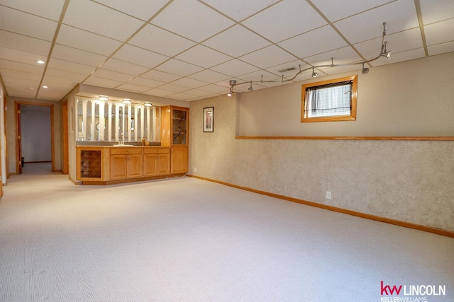 basement featuring light carpet