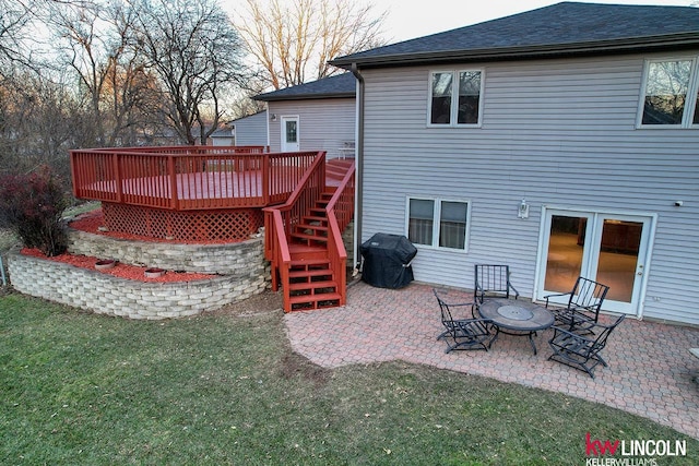 back of property with a patio and a wooden deck