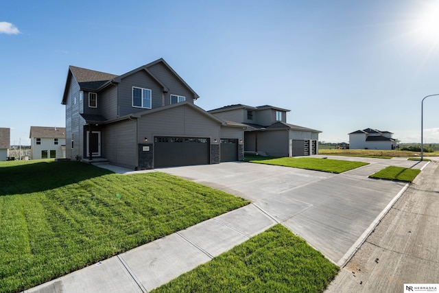 view of front of home featuring a garage and a front lawn