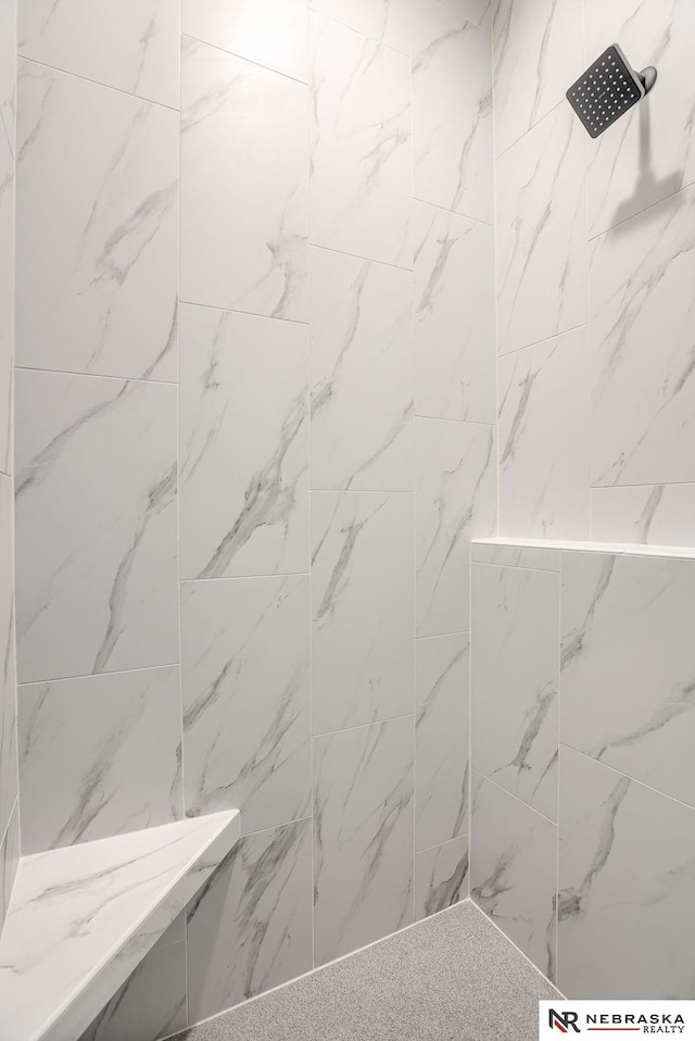 bathroom with a tile shower