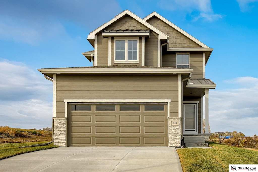 craftsman-style home with a garage