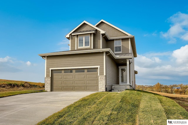 view of front of house featuring a garage and a front yard