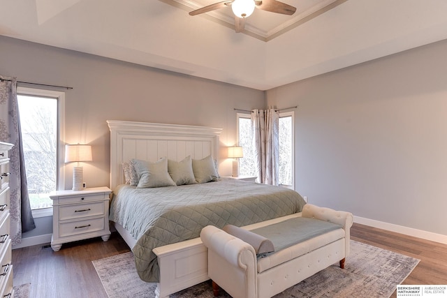 bedroom featuring multiple windows, ceiling fan, and dark hardwood / wood-style flooring