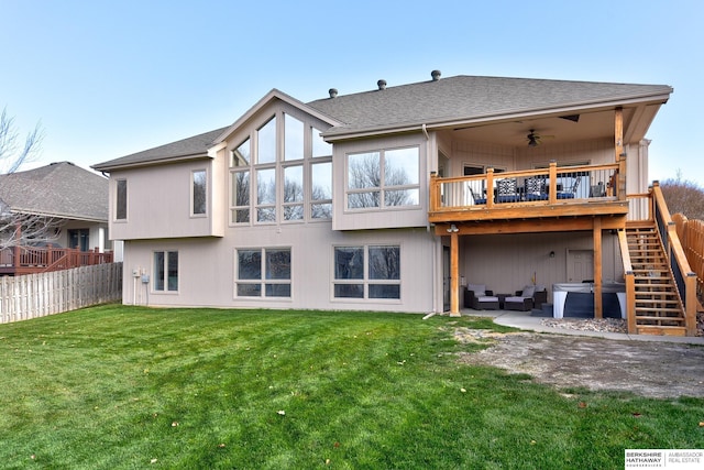 rear view of property featuring outdoor lounge area, ceiling fan, a patio area, and a yard