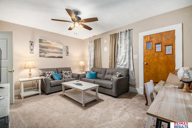 carpeted living room featuring ceiling fan