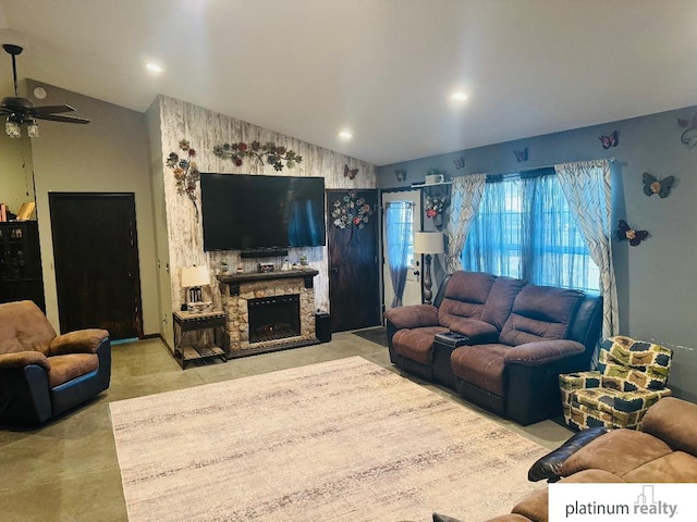 living room featuring a fireplace and ceiling fan