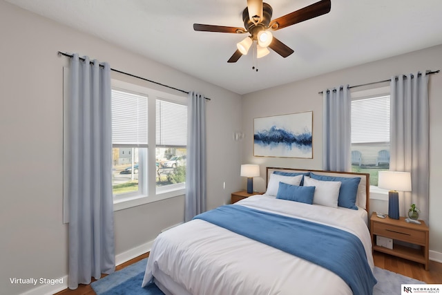 bedroom featuring hardwood / wood-style flooring and ceiling fan