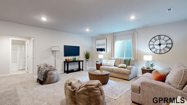 living room featuring light carpet