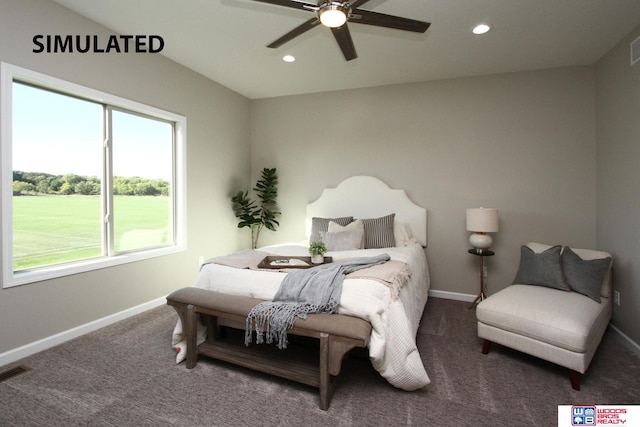 bedroom featuring ceiling fan and carpet