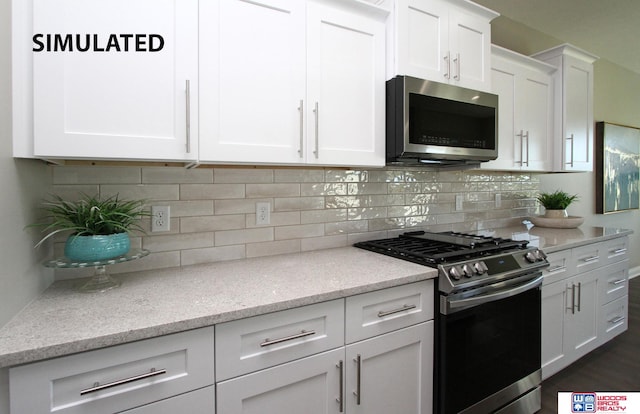 kitchen featuring decorative backsplash, dark hardwood / wood-style floors, light stone countertops, appliances with stainless steel finishes, and white cabinetry