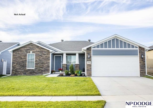 view of front facade with a front yard and a garage