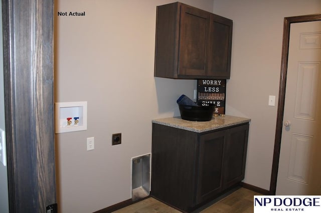 laundry room with hookup for an electric dryer, hookup for a washing machine, cabinets, and hardwood / wood-style floors