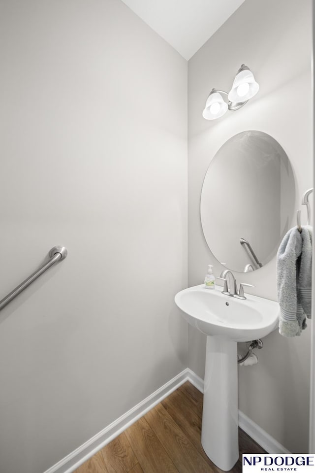 bathroom with wood-type flooring