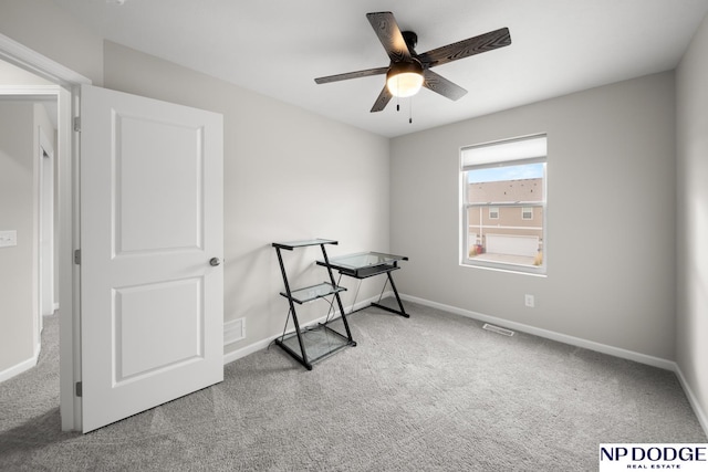 office area with carpet and ceiling fan