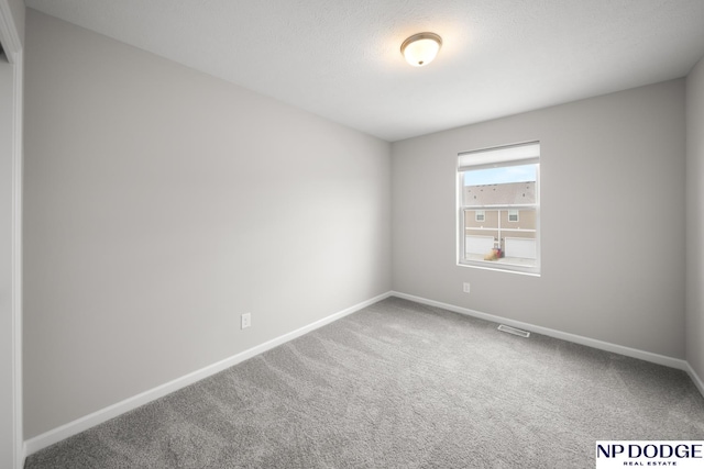 spare room with carpet floors