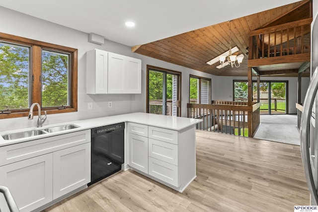 2729 N 129th Cir, Omaha, NE 68164 - kitchen featuring black dishwasher, a sink, a peninsula, healthy amount of natural light, and vaulted ceiling