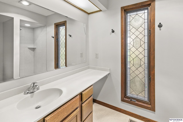 2729 N 129th Cir, Omaha, NE 68164 - bathroom featuring vanity, baseboards, and recessed lighting