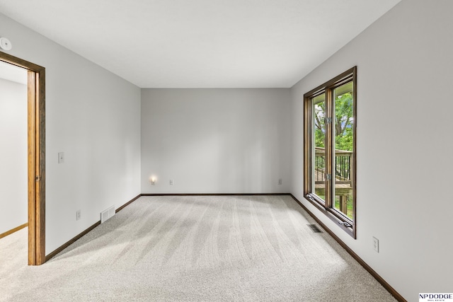 2729 N 129th Cir, Omaha, NE 68164 - spare room featuring carpet, baseboards, and a smoke detector