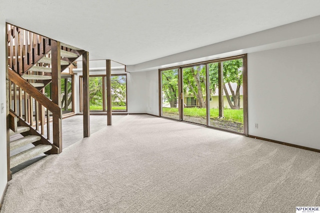 2729 N 129th Cir, Omaha, NE 68164 - spare room with carpet flooring, stairs, and baseboards