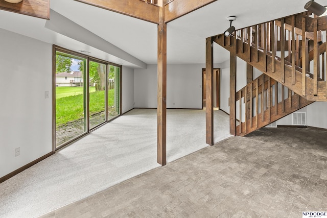 2729 N 129th Cir, Omaha, NE 68164 - unfurnished living room featuring baseboards, stairway, and carpet flooring