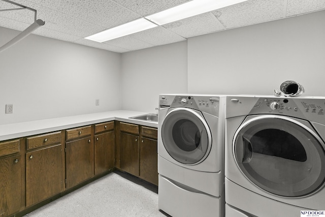 2729 N 129th Cir, Omaha, NE 68164 - washroom with washing machine and clothes dryer and cabinet space