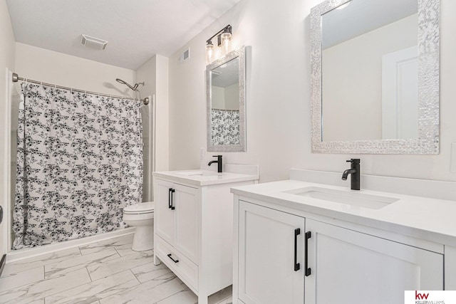 bathroom with a shower with curtain, vanity, a textured ceiling, and toilet