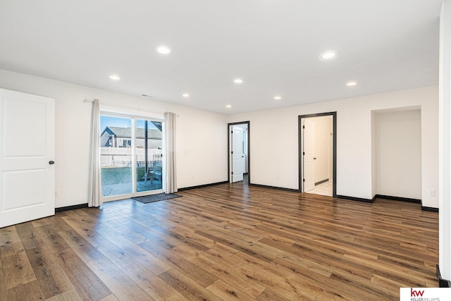 empty room with wood-type flooring