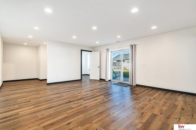 empty room featuring wood-type flooring